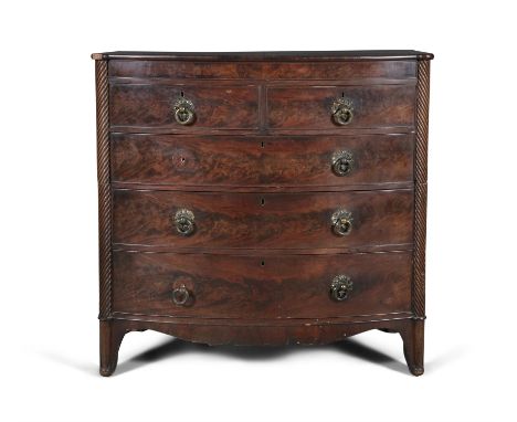 A VICTORIAN MAHOGANY BOWFRONT LARGE CHEST OF DRAWERS, the plain top above two short and three long cockbeaded drawers, with b