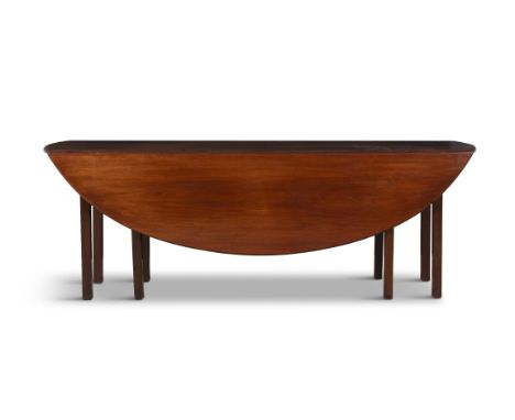 A LARGE MAHOGANY HUNT TABLE 19TH CENTURY, with moulded edge on squared gate leg action supports. 72cm high, 205cm diameter***