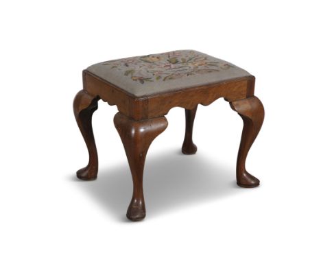 A WALNUT FRAMED RECTANGULAR STOOL 19TH CENTURYfitted with drop-in tapestry seat, on cabriole legs and pad feet. 43cm high, 53