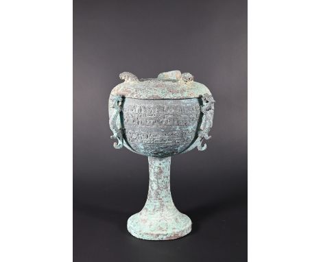 A Chinese bronze ritual food vessel and cover in the Warring States style, Dou, the bowl has four cast Chilong dragon handles