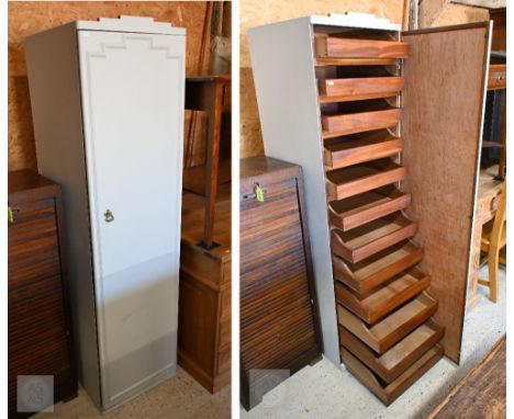 A vintage ship's cupboard, the single door enclosing twelve drawers, later painted 48 cm x 55 cm x 175 cm high