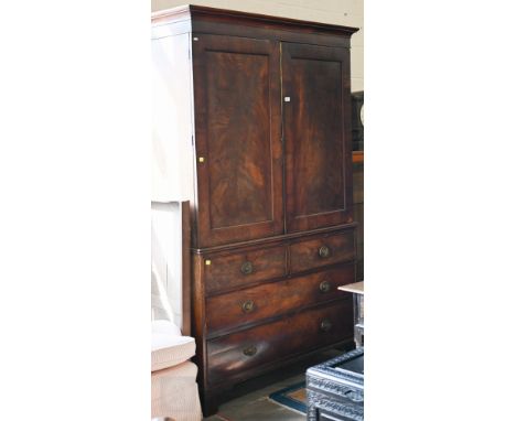 A Regency mahogany linen press, the converted interior with three slides and hanging space on the chest base with two short a
