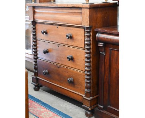 A Victorian mahogany chest with cushion moulded cavetto drawer and three standard drawers with turned handles and mouldings s