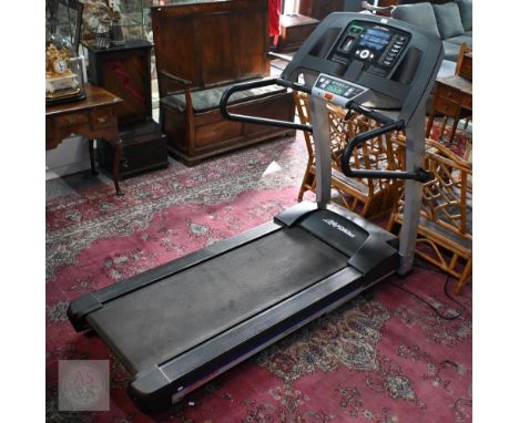 A 'Life Fitness' electronic treadmill, foldable flex-deck, circa 2012 with manual, little used