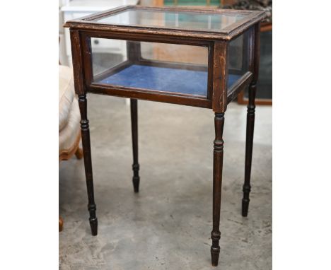 An early 20th century mahogany glazed vitrine on slender turned legs, 52 x 40 x 74 cm high