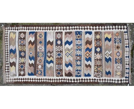 A vintage Afghan Kelim rug with geometric banded design and diamond border, 299 x 142 cm