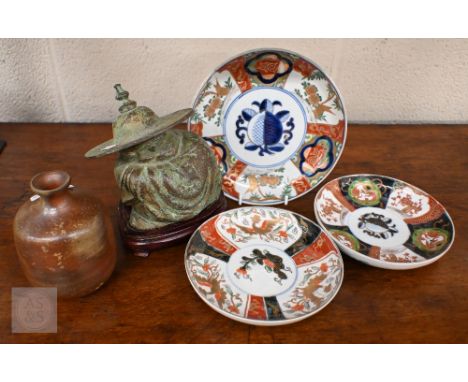 Three antique Japanese Imari dishes, 18/15 cm diam to/w a studio stoneware vase, a bronzed figure of a sleeping sage and a 19