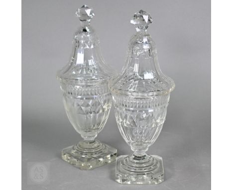 A pair of early 19th century cut glass sweetmeat jars and covers with facetted finials, on star-cut square bases with chamfer