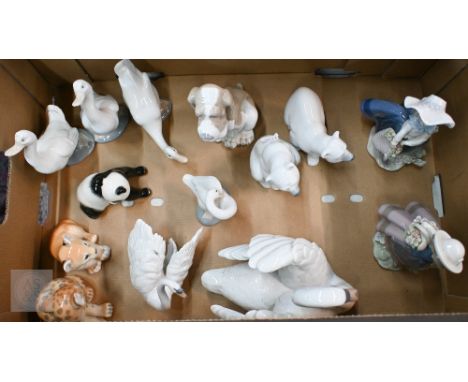 Two Lladro girls with baskets of flowers, two polar bears, two swans and a duck, a Nao dog and three ducks, to/w three Lomono