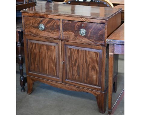 A 19th century figured mahogany side cabinet with two drawers over fielded panelled cupboard doors on shaped bracket feet, 88