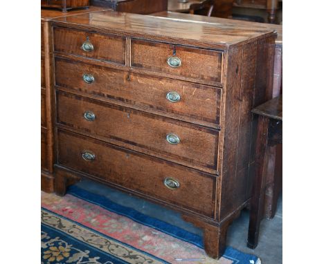 A George III oak and mahogany crossbanded chest of two short over three long drawers raised on bracket feet, 104 x 45 x 98 cm