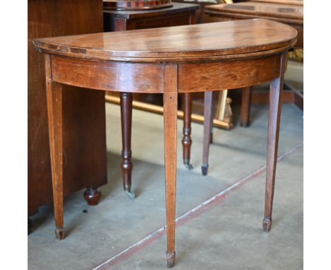 A 19th century mahogany crossbanded demi lune card table with folding baize lined top on tapering square supports, 100 x 50 x