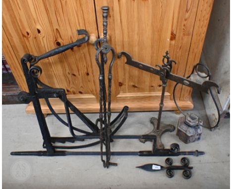 An antique wrought iron swinging cauldron - bracket with adjustable height etc 