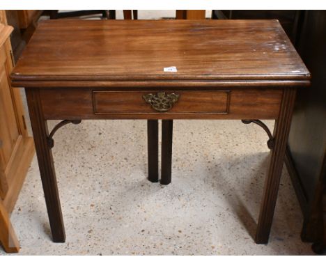 A George III mahogany folding card table with single frieze drawer raised on moulded square supports, 86 cm x 42 cm x 72 cm h