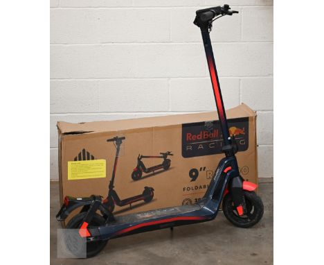 A Red Bull Racing 9" RS900 foldable E-scooter, with box