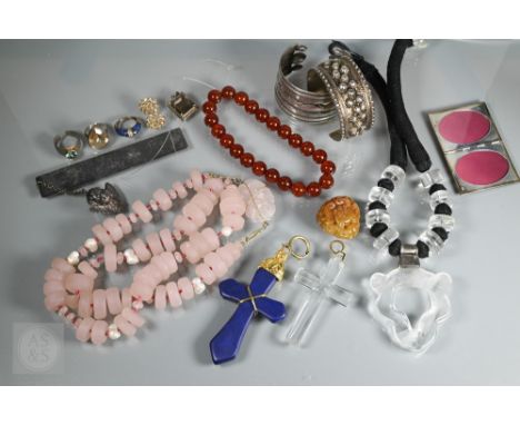 A row of opaque rose quartz beads and carved rose quartz bead, cornelian beads, carved agate leiwen and taotsie mask amulet, 