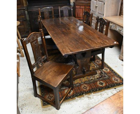A heavy quality 17th century style oak refectory dining table to/with a set of six moulded and carved oak dining side chairs 
