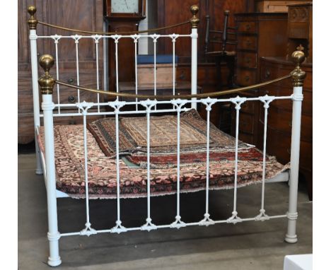 And So To Bed, a traditional kingsize iron/brass bedstead with wood-slat base, 150 cm w x 210 cm x 150 cm h o/all