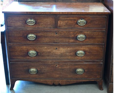 A George III mahogany crossbanded chest of two short over three long drawers with embossed brass handles depicting Nelson ins