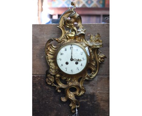 An antique French gilt metal 8-day cartel clock, the 8-day two train movement by Japy Freres, striking the half and hours on 