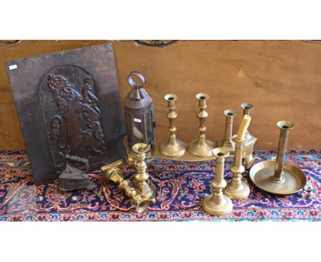 A Victorian brass footman on cabriole supports and an antique oak panel carved with a heraldic Royal Lion, four pairs of 19th