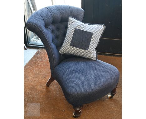 A Victorian mahogany framed low bedroom chair, navy blue chenille buttonback upholstery c/w with gingham cushion