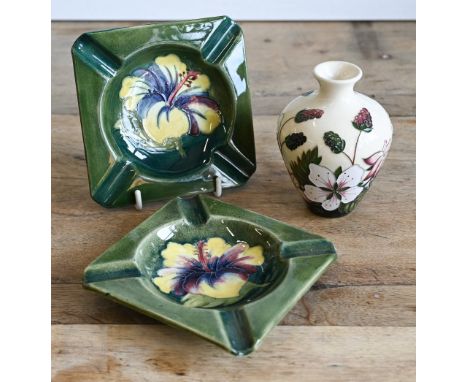Two vintage Moorcroft pottery ashtrays with floral decoration, to/w a later 'Bramble Revisited' small vase (3)