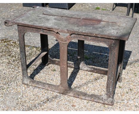 Bamfords Ltd, Uttoxeter, an old weathered cast iron agricultural saw bench table, 127 cm x 61 cm x 76 cm h, incomplete, weath