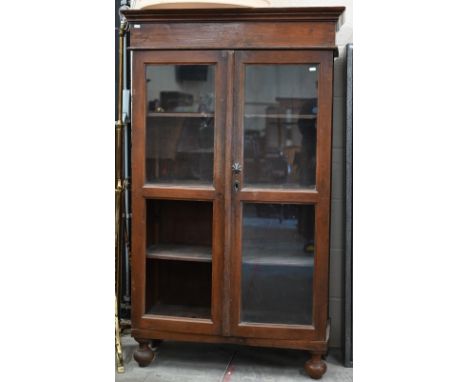 A stained hardwood glazed two door bookcase (lower left panel missing), on turned feet, 90 x 40 x 148 cm high