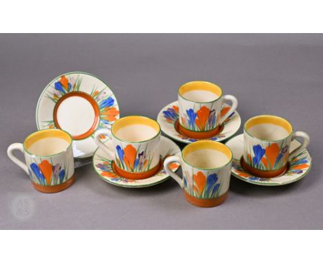 Five Clarice Cliff 'Crocus' coffee cans and four saucers (a/f)