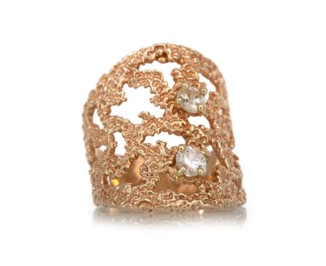 DIAMOND RING MID 20TH CENTURY   with two round brilliant cut diamonds to a pierced mount, unmarked, size K  Qty: 7.5g  Well w