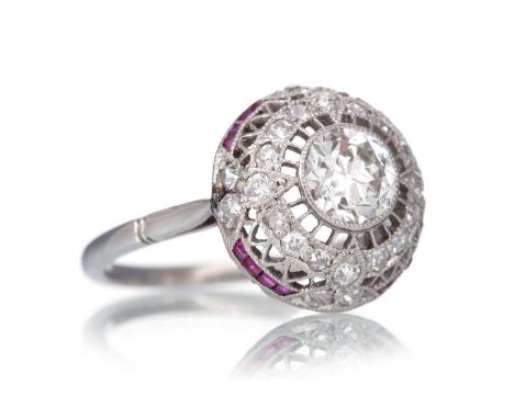 RUBY AND DIAMOND TARGET RING  set with a central Old European cut diamond of approximately 0.70 carats, within a pierced moun