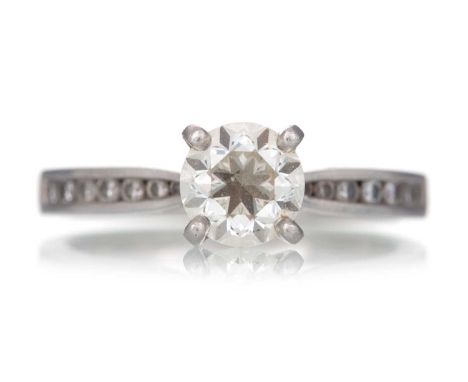 DIAMOND DRESS RING, set with a central diamond of approximately 0.90 carats, on diamond shoulders, in platinum, size K 1/2Qty