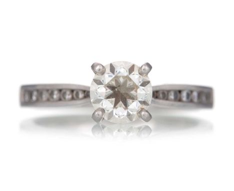 DIAMOND DRESS RING, set with a central diamond of approximately 0.90 carats, on diamond shoulders, in platinum, size K 1/2Qty