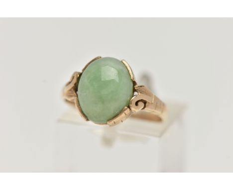 A 9CT GOLD JADE RING, jade cabochon collet set to the scrolling shoulders and polished band, hallmarked 9ct Sheffield, ring s