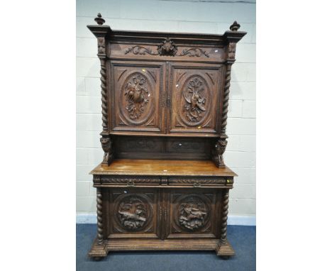 AN EARLY 20TH CENTURY FRENCH CARVED OAK BUFFET CABINET, each panel depicting either pheasants, fish, dog and deer, the top se