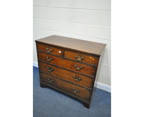 A  GEORGIAN OAK AND CROSS BANDED CHEST OF TWO SHORT OVER THREE LONG DRAWERS, with brass swan neck handles on bracket feet, wi