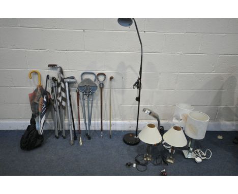 A SELECTION OF LAMPS AND WALKING STICKS, comprising of five table lamps, one standing lamp, three umbrellas, four walking sti