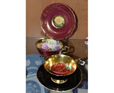 TWO PARAGON TEACUPS AND SAUCERS, one in A1571/1 pattern, the cup with gilt interior printed with chrysanthemums, the exterior