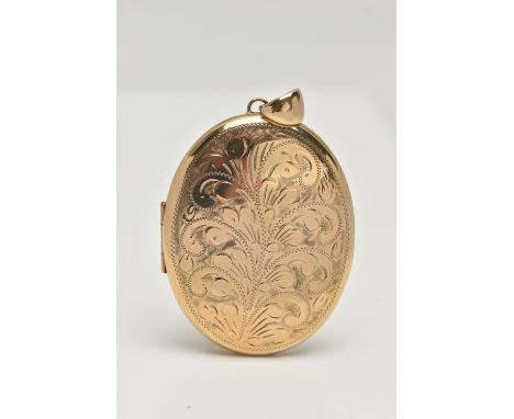 A LARGE OVAL LOCKET, floral design to the front, opens to reveal two photo compartments, approximate dimensions length 53.2mm