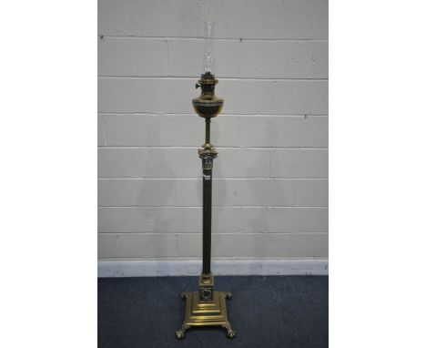 A 19TH CENTURY BRASS TELESCOPIC OIL LAMP, with a glass funnel and reservoir on a Corinthian column support, on a square stepp