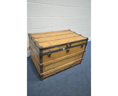 A 19TH CENTURY PINE TRAVELLING TRUNK, with metal banding, width 92cm x depth 56cm x height 62cm (condition:- historical damag