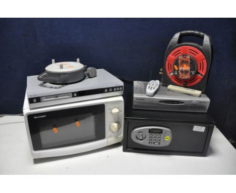 A SELECTION OF ELECTRICXAL ITEMS to include a Sharp R209 microwave, Grundig sky Digi box, Pye PRV645 DVD recorder, two unbran