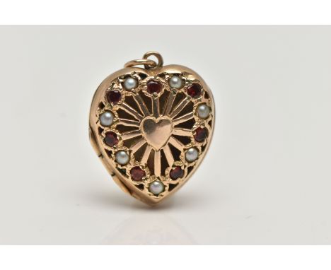 A 9CT GOLD HEART LOCKET PENDANT, openwork heart shape pendant set with alternating garnets and split pearls, fitted with a ju