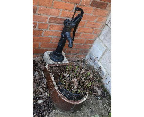 A VINTAGE TREACLE GLAZED TROUGH with one curved end depth 57cm, a vintage water pump and a stone block (3)( this lot is not s