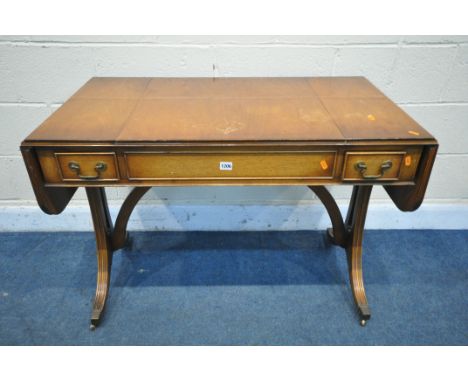 A BEVAN FUNNEL REPRODUX MAHOGANY DROP LEAF GAMES SOFA TABLE, with reversible slide top enclosing backgammon and chess boards,