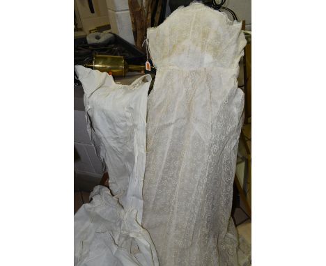 A BOXED WEDDING DRESS AND THREE BABY'S GOWNS, the cream net covered wedding dress approximately size 8-10 (in poor condition 