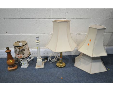 FOUR VARIOUS TABLE LAMPS, to include an Arts and Craft brass lamp, two marble lamps and a rustic live edge lamp, all with sha