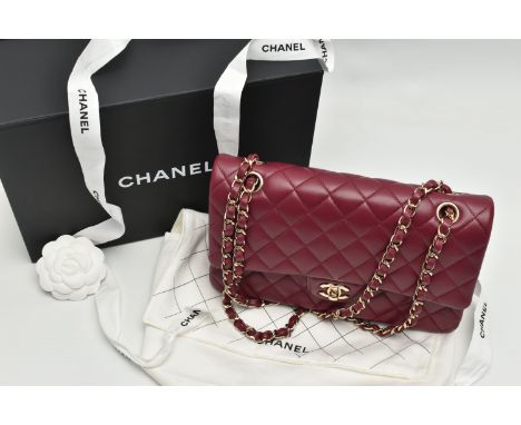 A CHANEL CLASSIC MEDIUM DOUBLE FLAP HANDBAG, with signature diamond quilted lambskin leather exterior, inner flap closure, re