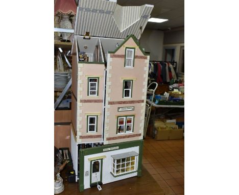 A LARGE WOODEN DOLLS HOUSE 'POPPIES FASHIONS &amp; HABERDASHERY' AND 'WILLOW TEA ROOMS', made by the Dolls House Cottage Work